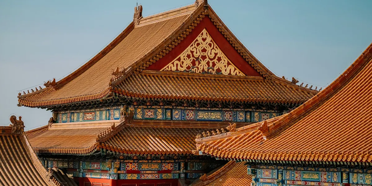 Golden roofs and painted eaves of the Forbidden City palaces in Beijing